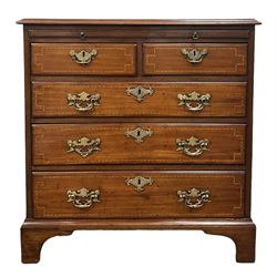 George III walnut bachelors chest, the rectangular top with chequered inlay, over dressing slide and two short and three long inlayed graduated drawers raised on bracket supports  