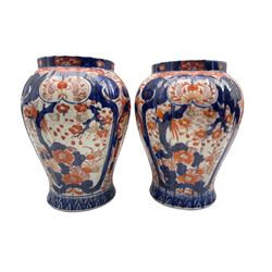 Pair of Japanese Meiji period Imari pattern vases of fluted inverted baluster form, H25.5cm 