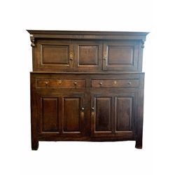 18th century oak court cupboard, the frieze carved with 'IR.AR' '1734' over two fielded panelled cupboards, two drawers and two panelled cupboards under, raised on stile supports 