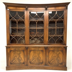 Bevan Funnell Reprodux Georgian style mahogany concave front bookcase, with dentil cornice over frieze with aplied acanthus carved corbels, three tracery glazed doors each enclosing three fixed shelves, three fielded cupboards under
