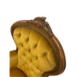 Pair late 20th century French style armchairs with cresting rail carved with leafed scroll, upholstered in buttoned mustard fabric 