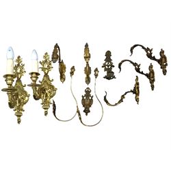 Set of four brass curtain tie backs, two pairs of tie backs and a pair of wall lights