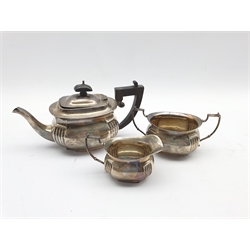 Bachelor's silver three piece tea set of rectangular design with reeded decoration, the tea pot with ebonised handle and lift Birmingham 1913 Maker Charles Boyton & Son 16oz 