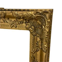 Pair rectangular ornate gilt mirrors, the frame decorated with shell and foliate cartouches, plain mirror plate