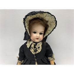 Armand Marseille 390 doll bisque headed doll with sleeping blue eyes, open mouth and teeth, jointed composition body wearing period black dress, petticoat and bonnet H37cm