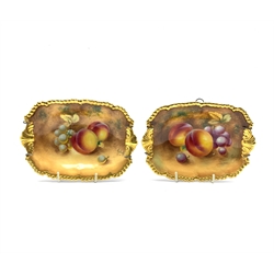 Pair of Royal Worcester hand painted rectangular dishes, each decorated with grapes and peaches within gilt gadrooned borders and shell handles, each indistinctly signed, 17.5cm x 12.5cm