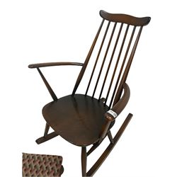 Ercol rocking chair, the shaped cresting rail with spindle back, raised on turned supports together with footstool