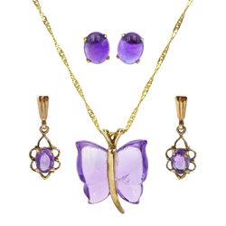 Gold amethyst butterfly pendant necklace, pair of gold cabochon amethyst stud earrings and a pair of gold amethyst pendant earrings, all stamped or hallmarked 9ct