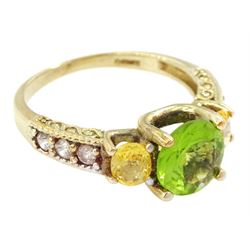 9ct gold peridot and yellow sapphire ring, with white topaz set shoulders, hallmarked