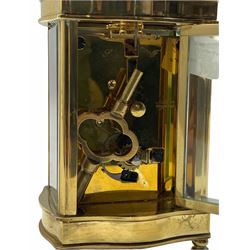 A mid-20th century English eight-day timepiece carriage clock with a lever platform escapement, overcoil balance spring with timing screws, Louis XV Doucine case on four turned bun feet, bevelled glass panels to the case and an oval glass panel to the top of the case, white enamel dial with Roman numerals, minute markers and steel moon hands, dial inscribed 