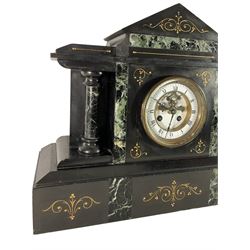 Late 19th century - 8-day Belgium slate and marble mantle clock, with a gable pediment, inlaid green variegated marble panels, gilt incised decoration and recessed circular columns, French movement with a two part enamel dial, Roman numerals, visible Brocot deadbeat escapement and steel fleur di Lis hands.
With pendulum.