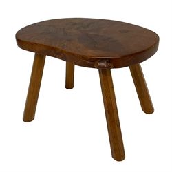 Beaverman - oak four-legged stool or occasional table, figured shaped top carved with beaver signature, on octagonal tapered supports, by Colin Almack of Sutton-under-Whitestone Cliffe