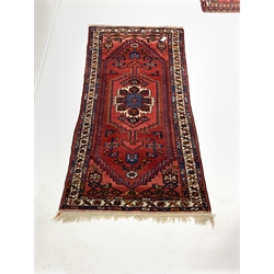  Red ground hand knotted Persian Hamadan rug with geometric design on red field, 102cm x 212cm  