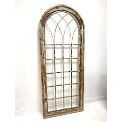 Modern rustic arched window frame, with pine and plywood frame enclosing  metal insert