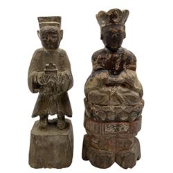 Chinese Qing dynasty carved and painted figure of a Deity seated on a throne, script to the reverse, another standing figure wearing a gold tunic and two others H18cm (4)
