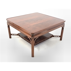 20th century mahogany coffee table, square top with canted corners raised on chamfered supports united by under tier 