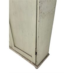 Victorian painted pine larder cupboard, projecting cornice over two panelled doors enclosing three shelves, raised on turned feet, in pale laurel green finish