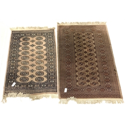 Persian design Bokhara rug, gul motif on beige field enclosed by multi line border (96cm x 160cm) together with a similar rug (83cm x 140cm)