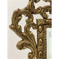 Gilt framed wall mirror with bevelled plate enclosed by scrolled acanthus leaves and egg and dart moulding (100cm x 75cm) together with an oval gilt framed wall mirror (53cm x 82cm)