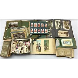Three post card albums and contents of vintage cards, assorted cigarette cards and a number of stereo cards