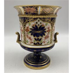 Early 20th century Royal Crown Derby Old Imari twin handled vase and cover, with acorn finial and circular foot, c1904, no. 1128 (A/F), H21cm, together with other Royal Crown Derby including an Old imari plate D21cm, globular vase, small campana urn and vase & cover, together with a Traditional Imari sugar bowl no. 2451 (6)