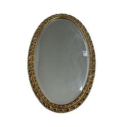 Gilt framed oval wall mirror 