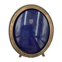 Late Victorian silver oval photograph frame with bead edge decoration, aperture size 7cm x 6cm, Birmingham 1900, a rectangular frame, aperture size 12cm x 8.5cm, Sheffield 1996 and a small silver frame (3)