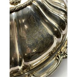 Pair of Victorian silver-plated entrée dishes and covers by Elkington & Co., the high domed covers engraved with a family crest above the motto 'Corde Et Manu', Lion head knop handles within a twisted rope border, L31cm (2)