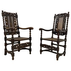 Late 19th century Carolean style oak open armchair, the cresting rail carved with pierced crown and scrolled foliage, cane work back and seat, spiral turned upright supports with moulded arms, turned and block supports joined by bobbin turned stretchers; together with a similar period Carolean style oak open armchair, the cresting rail carved and pierced with scrolling foliage and central shell motif, the arms carved with acanthus leaves, cane work seat and back, on spiral turned and block supports and stretchers 