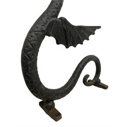 Cast iron bench ends in the form of winged dragons