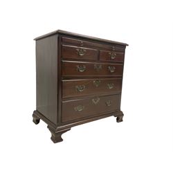 George III mahogany bachelors chest, the moulded rectangular top over brushing slide with inset leather surface, fitted with two short and three long graduating drawers, each with moulded fronts and oak lined, mounted with ornate brass handle pulls and escutcheons, raised on ogee feet