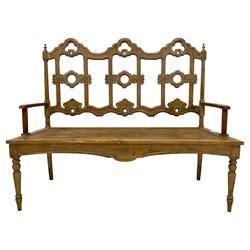 French Gothic design pine bench, open back pierced and carved with scrolls, on turned front supports