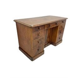 Early 20th century mahogany knee hole desk, the rectangular top with moulded edge over three short drawers, over six graduated drawers flanking one central cupboard W130cm, H79cm. D63cm
