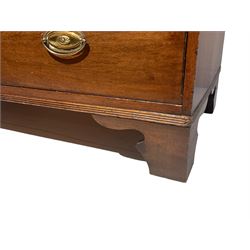 George III mahogany straight-front chest, rectangular top with reeded edge over two short and three long graduated drawers, fitted with oval plate and swing handles, on bracket feet