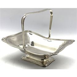 Silver rectangular fruit dish with beaded and shell moulded border, swing handle and pedestal foot W28cm Sheffield 1923 Maker Walter and Charles Sissons 25.6oz 