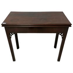 George III figured mahogany card table, the moulded rectangular top opens to reveal a baize lined interior, on concertina action base with sliding storage compartment, on square supports with inner chamfer, fretwork corner brackets