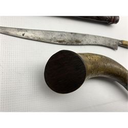 19th century European powder horn with incised decoration L21cm and an Eastern knife with horn handle, the blade with traces of hatched decoration in carved scabbard L54cm
