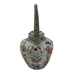 Chinese famille verte porcelain wine pot with associated cover, Kangxi period, with lobed tapering body and tall arch handle in imitation of bamboo, painted with butterflies, insects, rockwork and flowers, H19cm. Provenance: From the Estate of the late Dowager Lady St Oswald