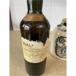 Black & White, Choice Old Scotch Whisky, Buchanans, 70° proof, 26 2/3 fl. ozs, one bottle together with The Grey Beard Heather Dew Blended Scotch Whisky in stoneware flagon (2)