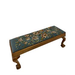 Early 20th century walnut footstool, the upholstered drop in pad, raised on cabriole supports with ball and claw feet 