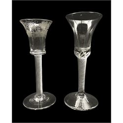 18th century cordial glass with waisted bucket shape bowl etched with vines on an air twist stem and another glass with air twist stem (2)