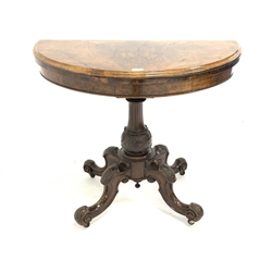  Victorian burr walnut demi-lune card table, the well figured fold over revolving top revealing baize lined played surface, raised on scrolled baluster turned column and four carved splayed supports, W92cm  