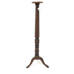 20th century mahogany torchere, circular dished top over leaf carved and spiral turned column, raised on three splayed supports 