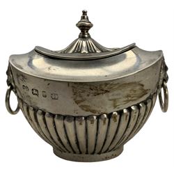 Late Victorian silver tea caddy of oval design with hinged lid, gilded interior, urn finial, half body reeded decoration and lion mask ring handles W10cm Birmingham 1898 Maker Thomas Hayes