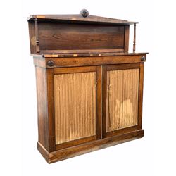Late Georgian rosewood chiffonier, the raised back with open shelf over two pleated silk lined doors enclosing two shelves, raised on plinth base W107cm, H126cm, D32cm