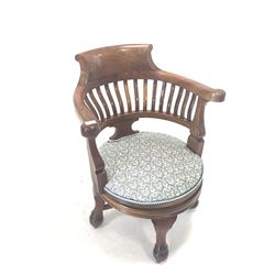 Edwardian mahogany desk chair, shaped crest rail over slatted back, upholstered seat, raised on swivel base with four turned supports and recessed castors, W68cm