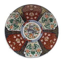 Japanese Meiji Imari charger, finely decorated with a Dragon to the central medallion,  painted with six panels, alternatively painted with lion dogs and scrolling foliage D47cm 