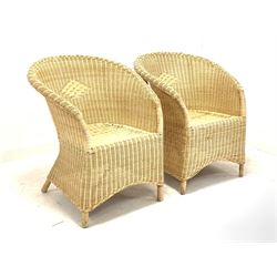Pair of tub shaped wicker conservatory chairs W69cm together with a circular bamboo table with glass top 