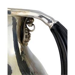 Georg Jensen silver water pitcher of baluster form with spot hammered decoration and ebony handle, with grapevine pattern beneath the handle H17cm, designed by Johan Rohde, Makers mark for Jorgen Jensen, import marks for 1971