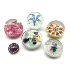 Six glass paperweights including two by Strathearn, Caithness, another having latticinio and leaf decoration and one other (6)